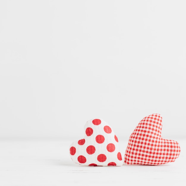 Free photo two handmade heart shaped toys