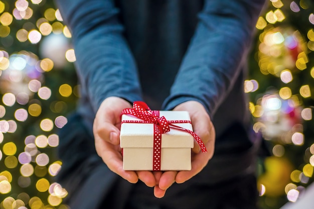 Two hands holding a present