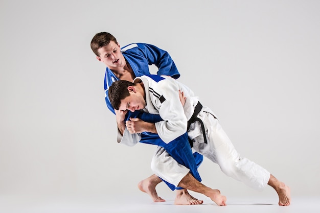 The two judokas fighters fighting men