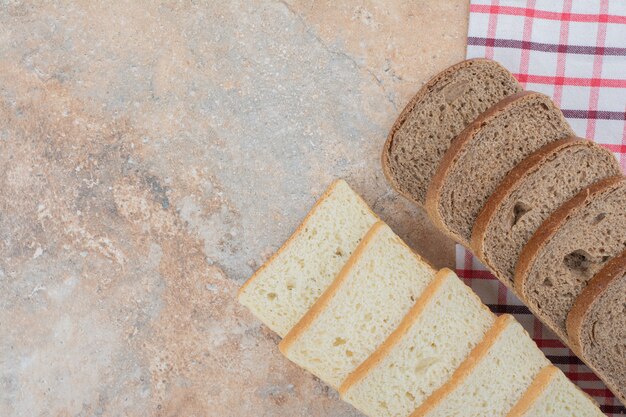 Two kinds of toast bread on tablecloth