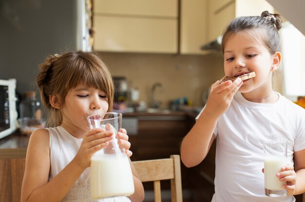 Two little girls having breakfast