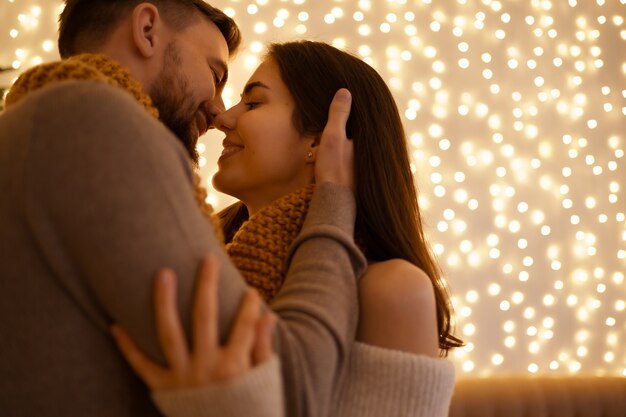 Two lovely sweet tender beautiful adorable cute romantic couple enfolding in one snood celebrating