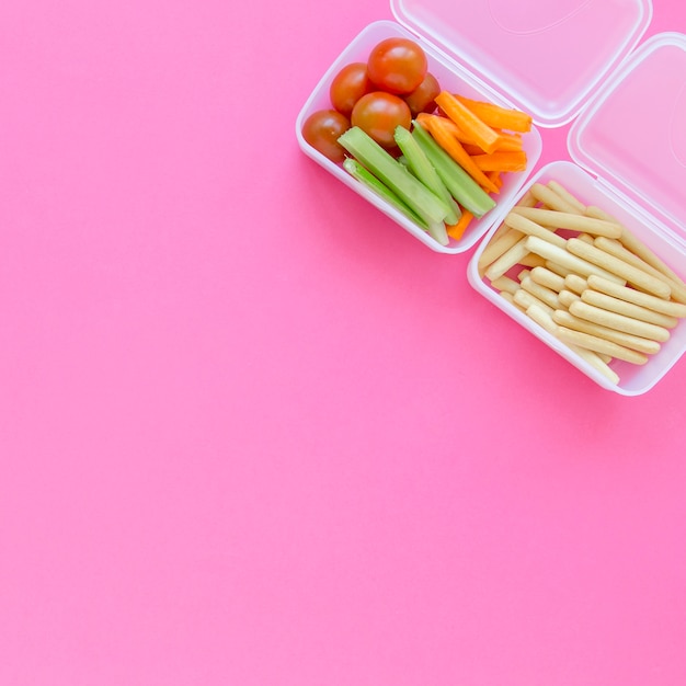 Two lunchboxes with school food