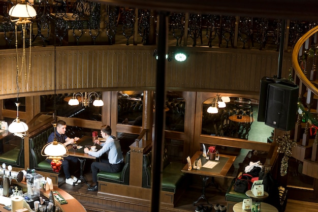 Two men in cafe