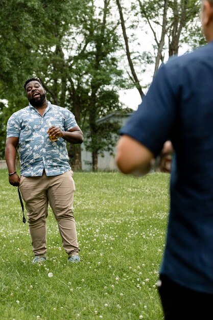 Two men having beers in the park