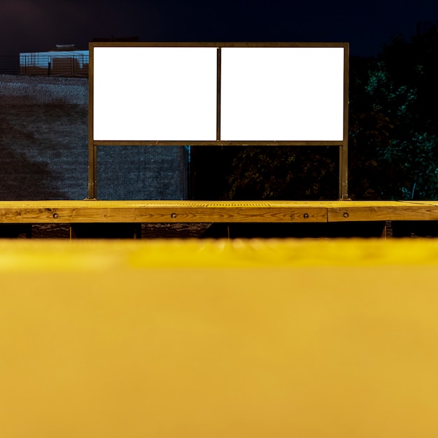 Two mock-up billboards on a bridge