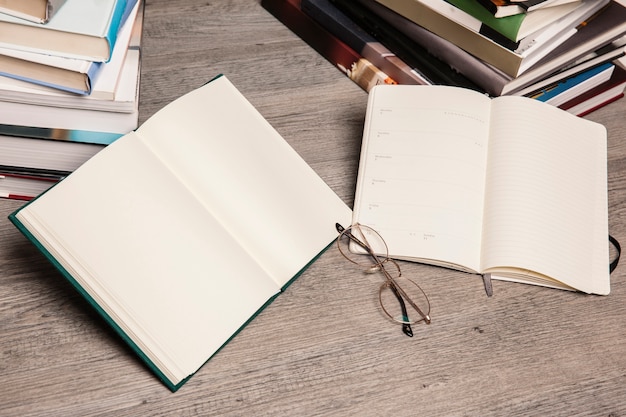 Two open books and glasses