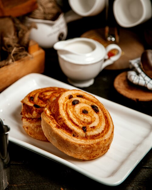 Two pastry rolls with raisins