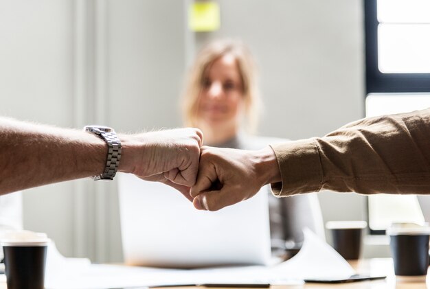 Two people giving a fist bump