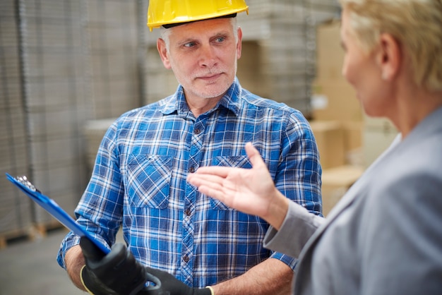 Two people working in warehouse