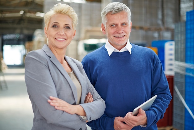 Two people working in warehouse