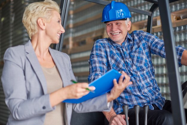 Two people working in warehouse