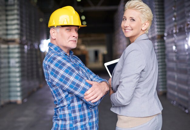 Two people working in warehouse