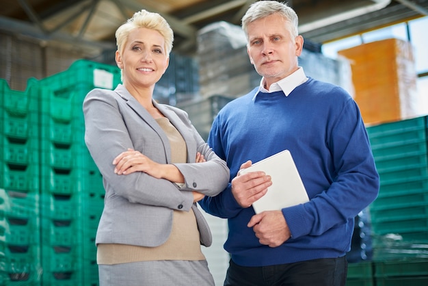 Two people working in warehouse