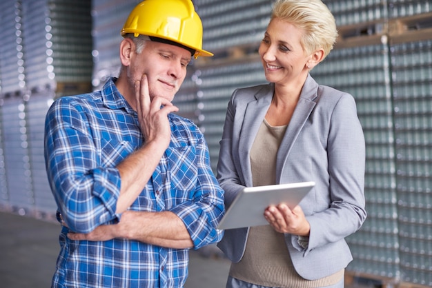 Two people working in warehouse