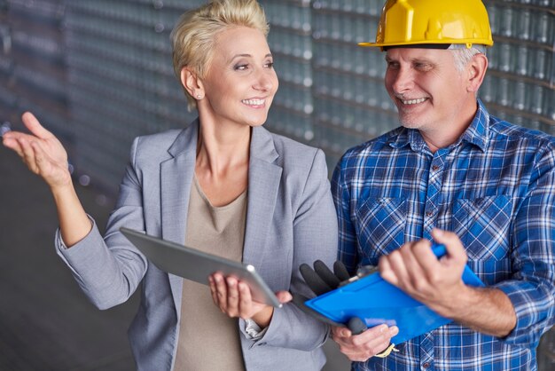 Two people working in warehouse