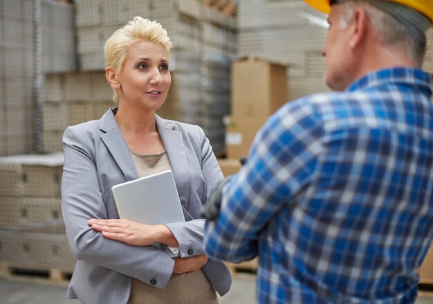 Two people working in warehouse