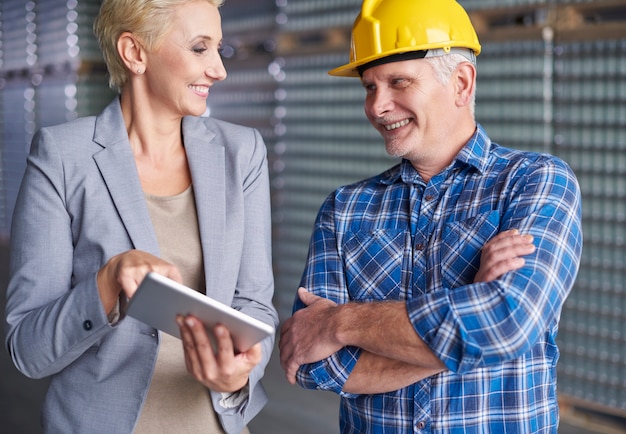 Two people working in warehouse