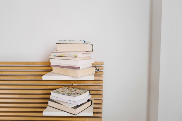 Free photo two piles of books and notebooks