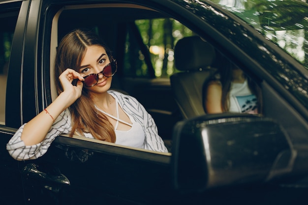 Two pretty girls in a car