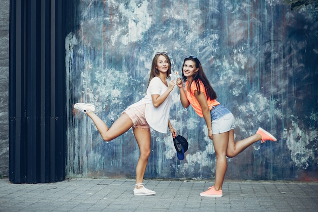 Free photo two pretty girls in a summer park