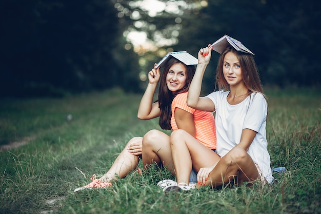 Two pretty girls in a summer park