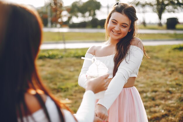 Two pretty girls in a summer park