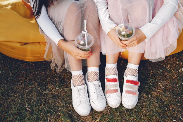 Two pretty girls in a summer park