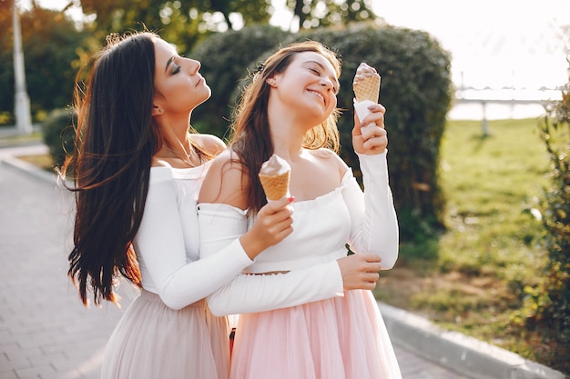 Two pretty girls in a summer park