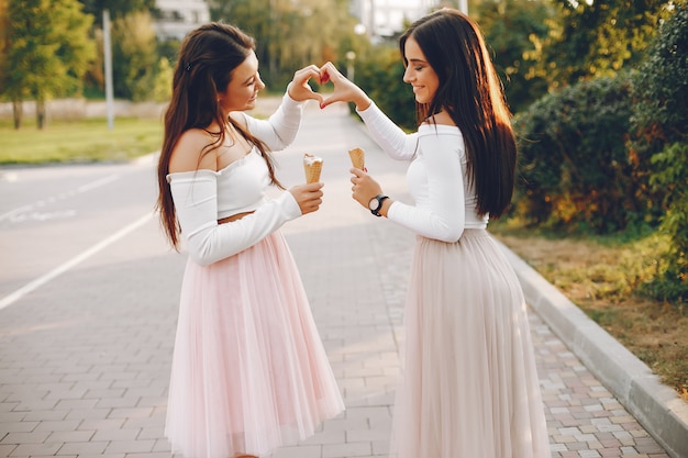 Two pretty girls in a summer park