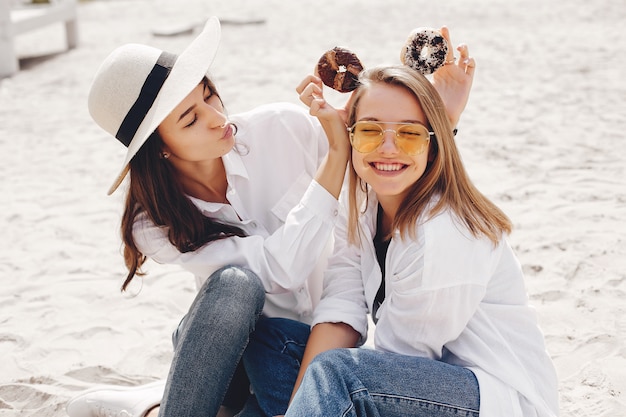 Two pretty girls in a summer park  