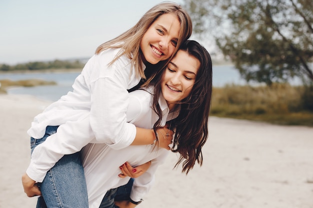 Two pretty girls in a summer park