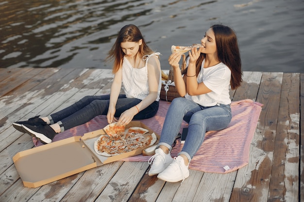 Two pretty girls in a summer park