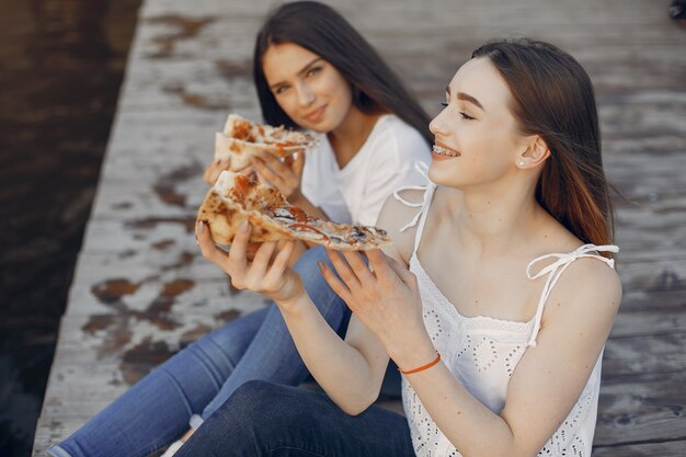 Two pretty girls in a summer park