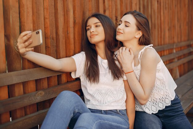 Two pretty girls in a summer park