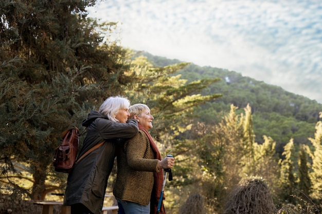 Two senior women enjoying a hike in nature