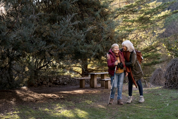 Two senior women enjoying a hike in nature