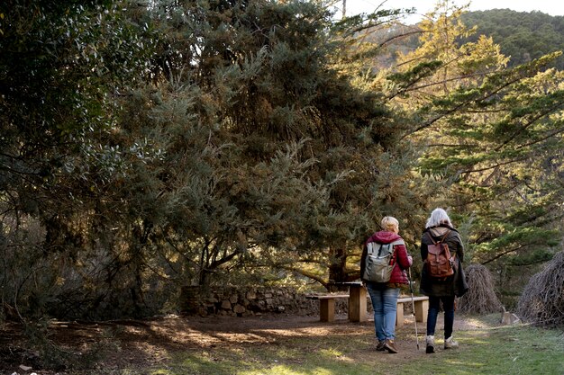 Two senior women enjoying a hike in nature