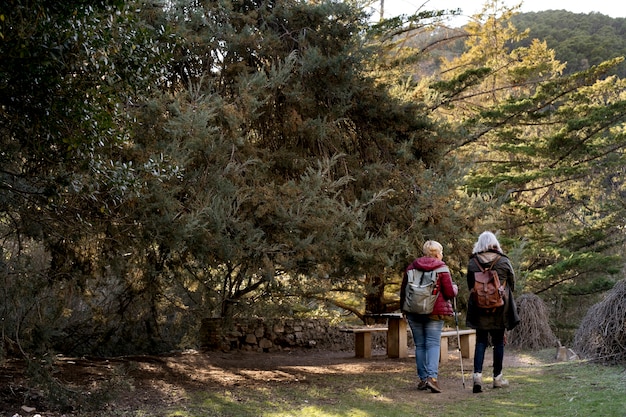 Two senior women enjoying a hike in nature