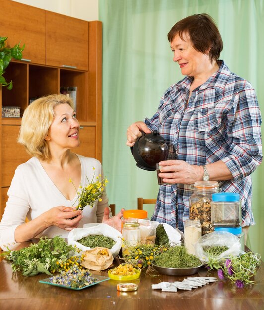 Two seniore women with  herbs