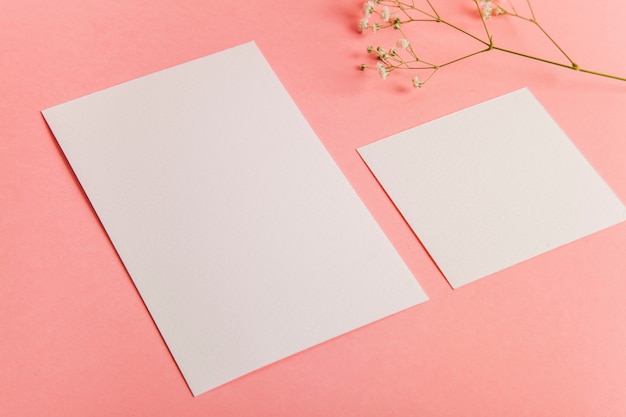 Free photo two sheets of blank paper