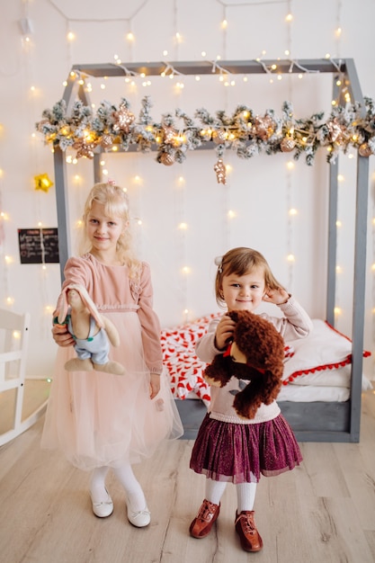 Two sister posing for picture during family photo shooting