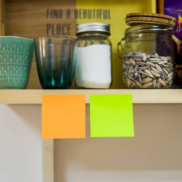 Two sticky notes in kitchen