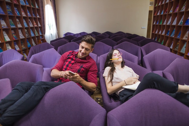 Free photo two students in library hall