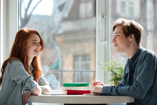 Two students talking in cafe