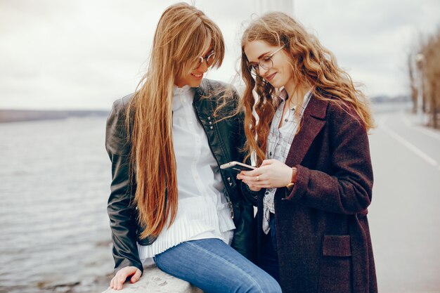 two stylish girl in a city