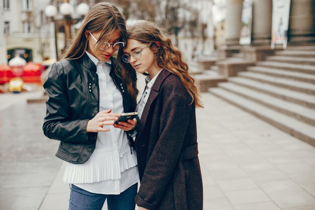 two stylish girl in a city