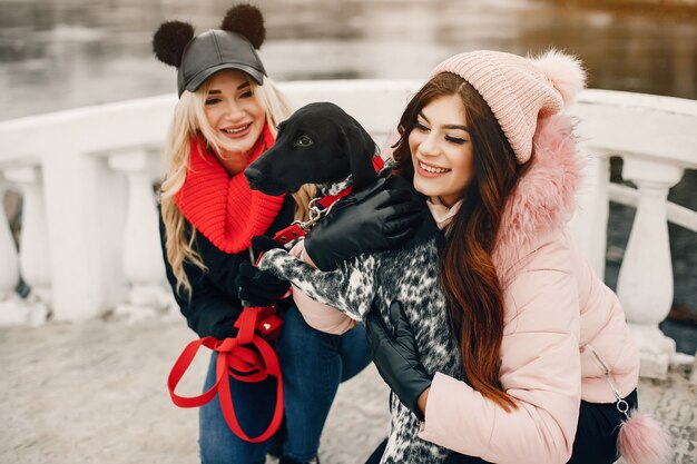 Two stylish girls have a rest in a city