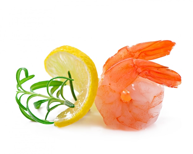 Two tail of shrimp with fresh lemon and rosemary on the white