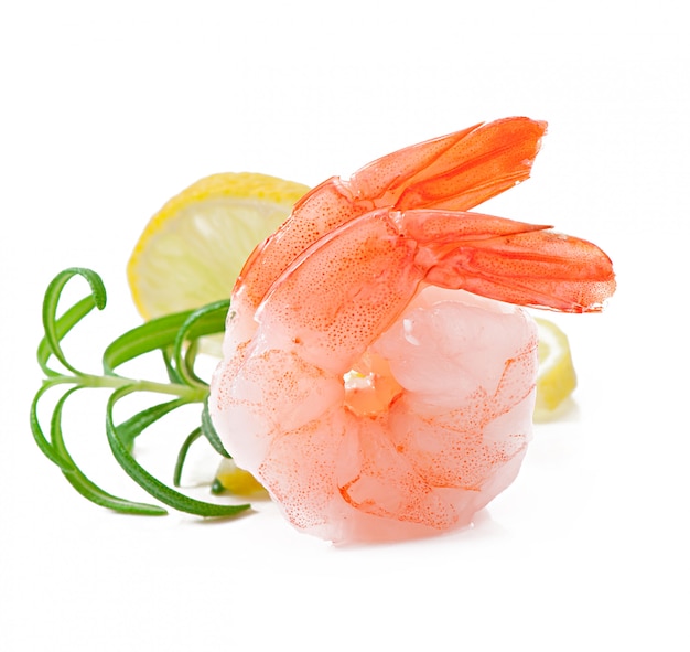 Two tail of shrimp with fresh lemon and rosemary on the white